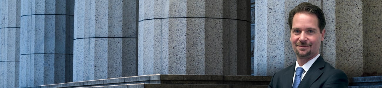 Attorney with columns in the background